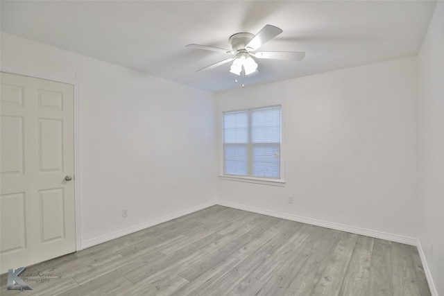 empty room featuring ceiling fan and light hardwood / wood-style flooring