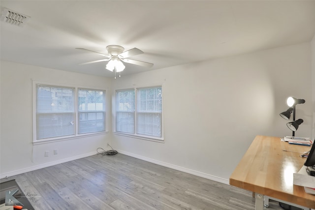 unfurnished room featuring ceiling fan and hardwood / wood-style flooring