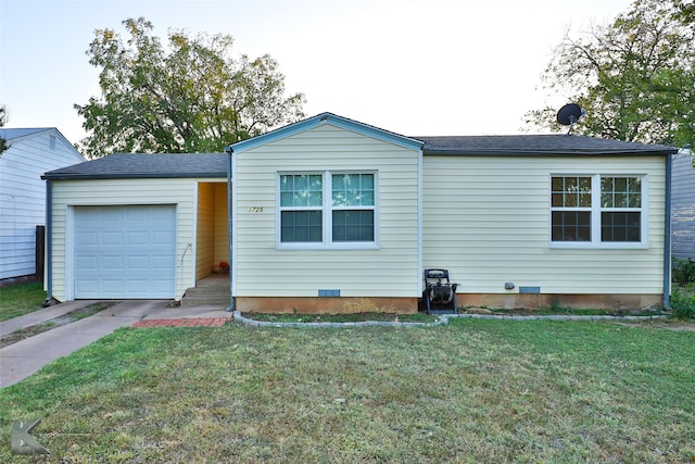 view of front of house with a front lawn and a garage