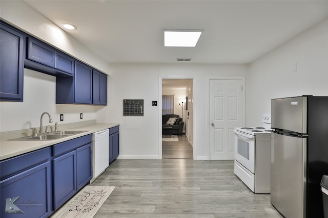 kitchen with blue cabinetry, sink, light wood-type flooring, and white appliances