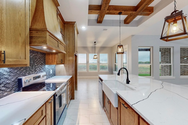 kitchen featuring plenty of natural light, tasteful backsplash, appliances with stainless steel finishes, and hanging light fixtures