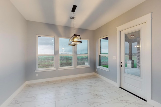 unfurnished dining area featuring a wealth of natural light