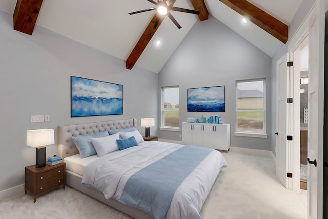 bedroom featuring beamed ceiling, light colored carpet, and ceiling fan