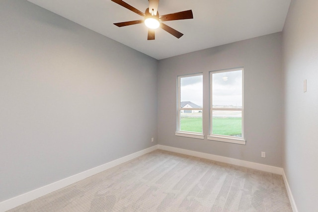 empty room with light carpet and ceiling fan