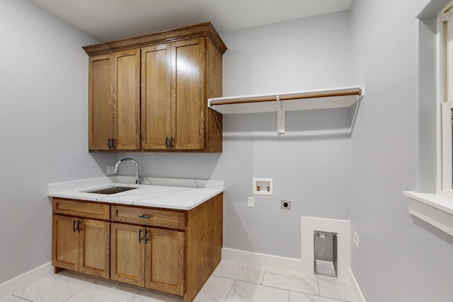 laundry area with hookup for a washing machine, cabinets, sink, and hookup for an electric dryer