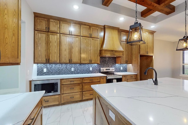 kitchen with sink, appliances with stainless steel finishes, custom range hood, beam ceiling, and pendant lighting