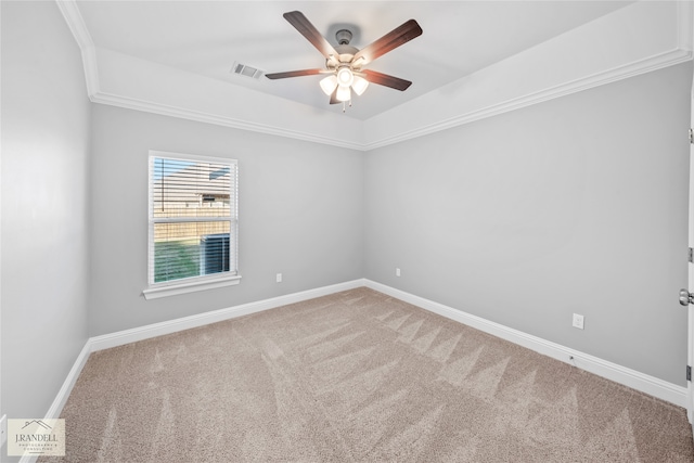 carpeted empty room with ornamental molding and ceiling fan