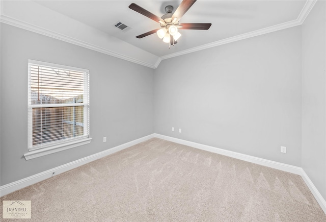 carpeted spare room with ornamental molding and ceiling fan