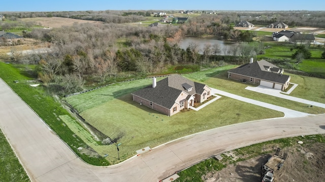 birds eye view of property featuring a water view and a rural view