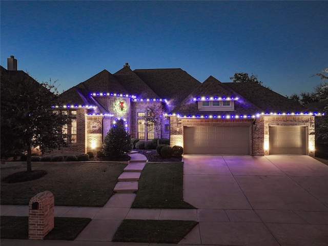 view of front of property featuring a garage