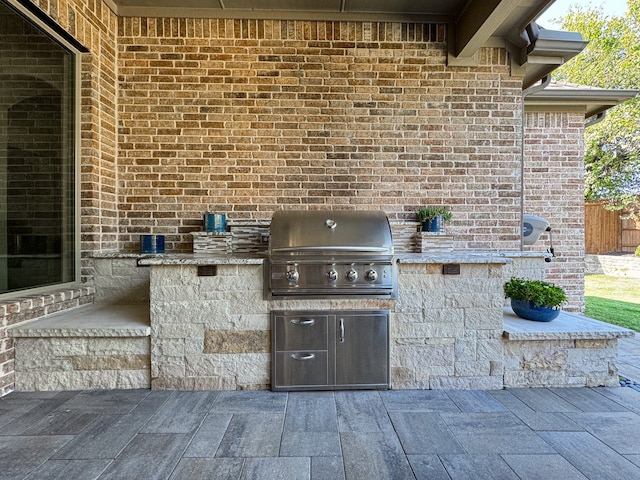 view of patio / terrace with a grill and exterior kitchen