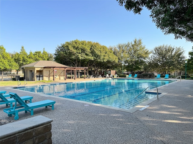 view of swimming pool featuring a patio area