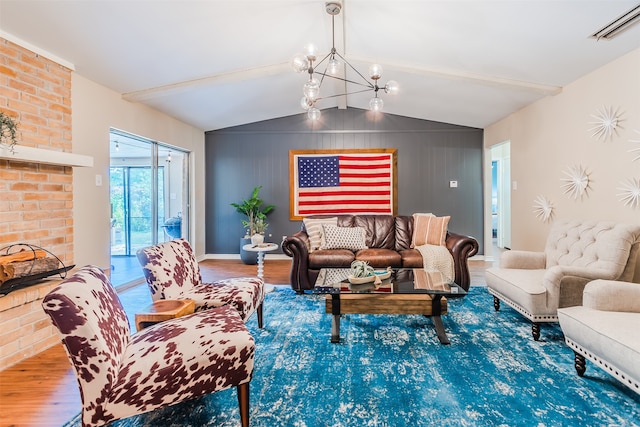 living room featuring a notable chandelier, hardwood / wood-style flooring, and vaulted ceiling