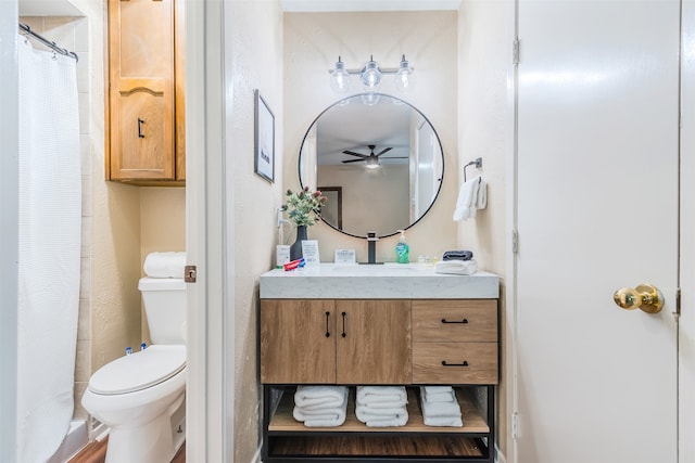 bathroom featuring vanity, hardwood / wood-style floors, curtained shower, and toilet