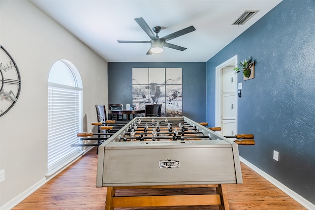 game room featuring hardwood / wood-style flooring, plenty of natural light, and ceiling fan