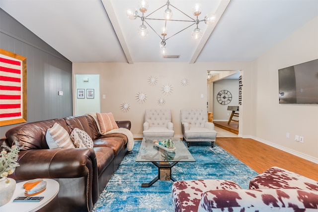 living room featuring vaulted ceiling with beams, an inviting chandelier, and wood-type flooring