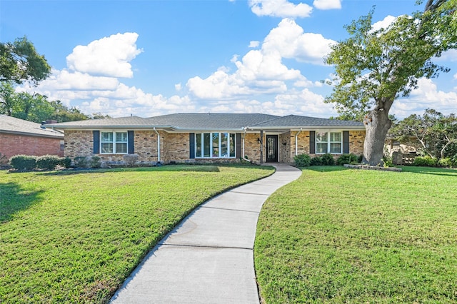 ranch-style home featuring a front yard