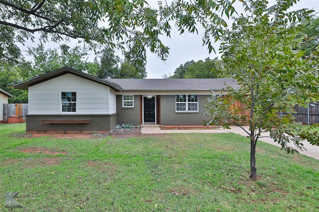 ranch-style house featuring a patio area and a front yard