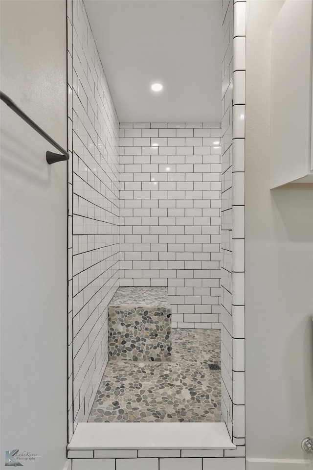 bathroom with tiled shower