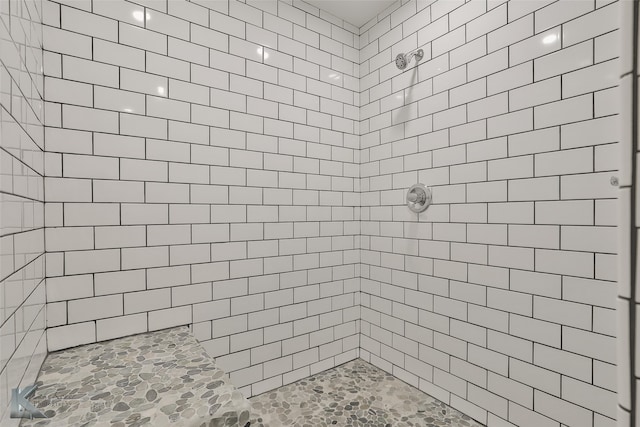 bathroom with a tile shower