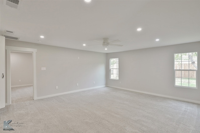 carpeted empty room with ceiling fan