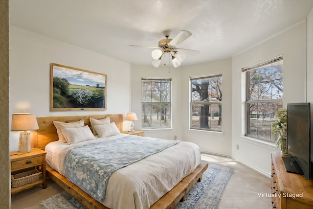 bedroom with ceiling fan and light carpet