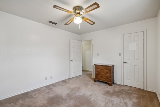 unfurnished bedroom with ceiling fan and light carpet