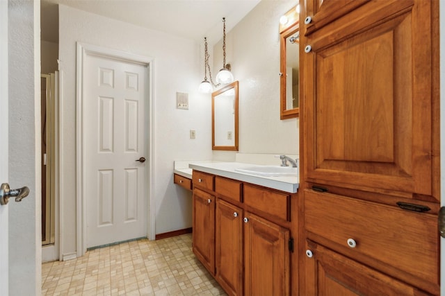 bathroom featuring vanity and a shower with door