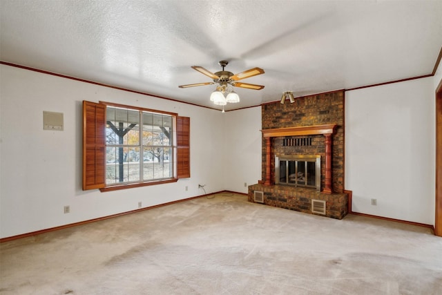 unfurnished living room with carpet, a textured ceiling, a brick fireplace, and ceiling fan