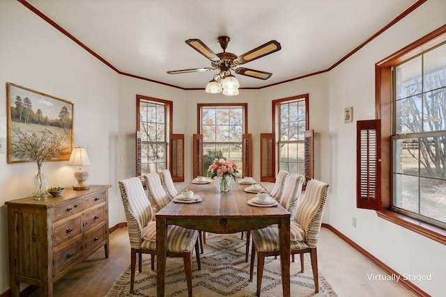 dining room with hardwood / wood-style flooring, ceiling fan, and crown molding