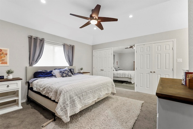 carpeted bedroom featuring two closets and ceiling fan