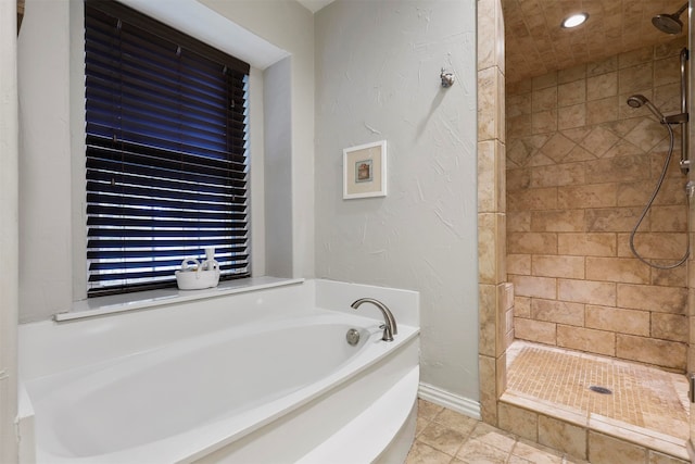 bathroom with independent shower and bath and tile patterned flooring