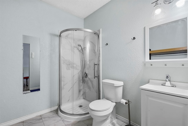 bathroom with vanity, toilet, a textured ceiling, and a shower with door