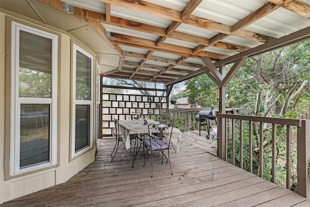 wooden terrace featuring a grill