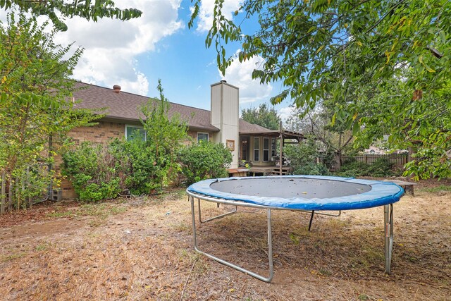 view of yard featuring a trampoline