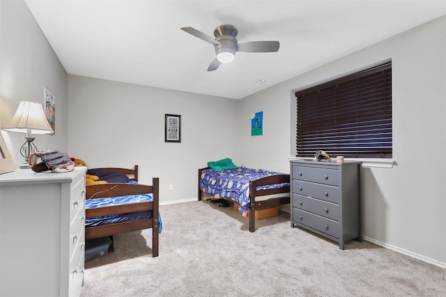 bedroom with light colored carpet and ceiling fan