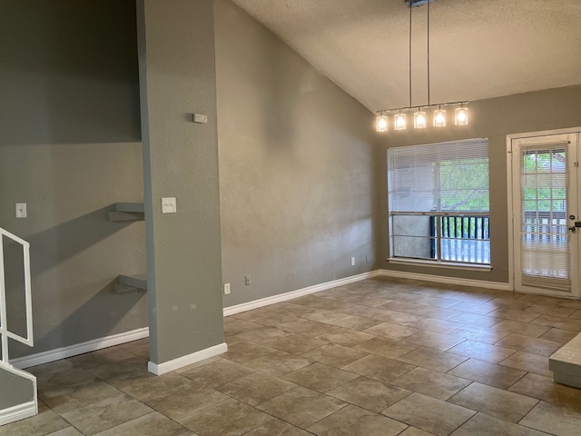 unfurnished dining area with a textured ceiling