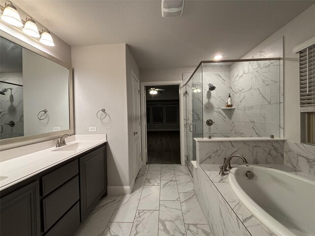 bathroom with vanity and independent shower and bath