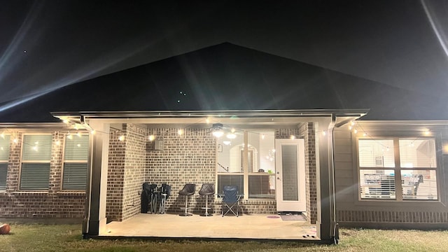 back house at night with a patio