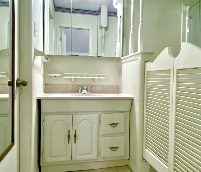 bathroom with tile patterned flooring and vanity