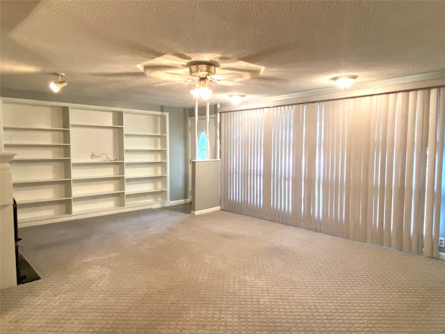 interior space with carpet flooring and a textured ceiling