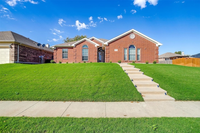 single story home with a garage and a front lawn