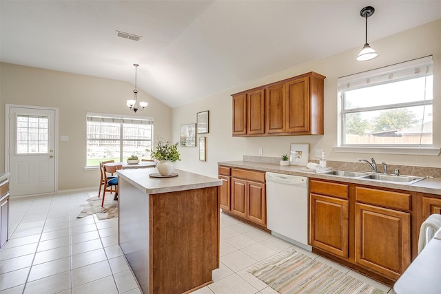 kitchen featuring dishwasher, hanging light fixtures, vaulted ceiling, and a center island