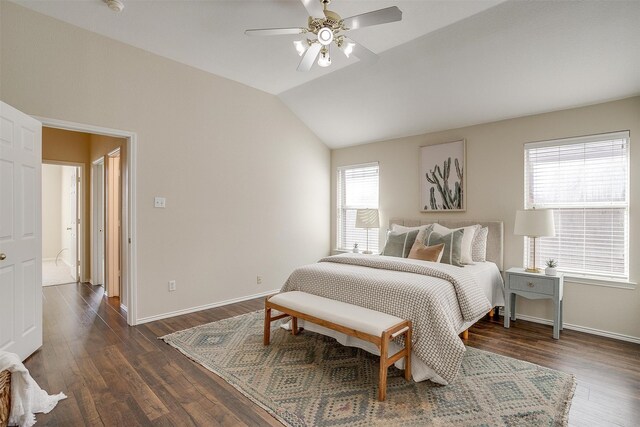 bedroom featuring dark wood-type flooring, ceiling fan, multiple windows, and vaulted ceiling