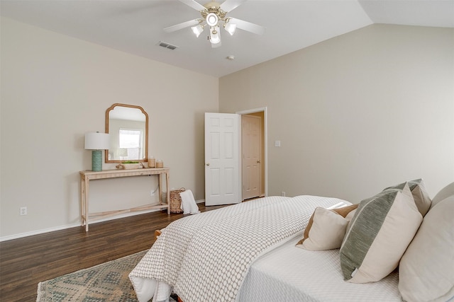 bedroom with dark wood-type flooring, ceiling fan, and lofted ceiling