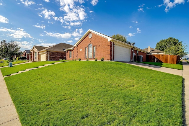 ranch-style house featuring a garage and a front yard