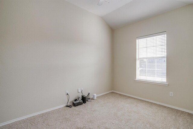 unfurnished room featuring ceiling fan, lofted ceiling, and carpet