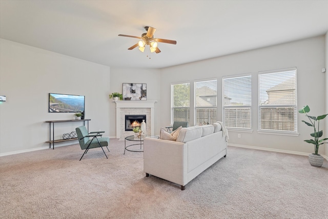 living room featuring light carpet and ceiling fan