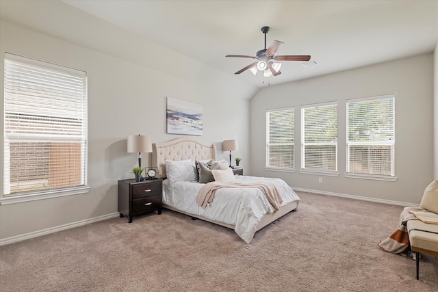 bedroom with light carpet, vaulted ceiling, and ceiling fan