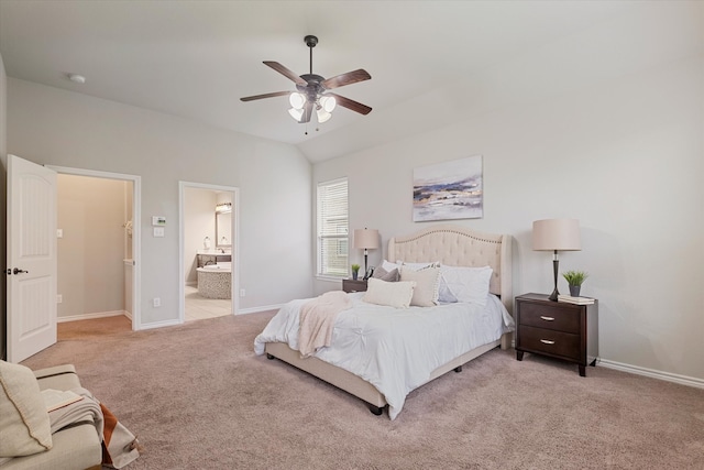 bedroom with ensuite bath, lofted ceiling, light colored carpet, and ceiling fan